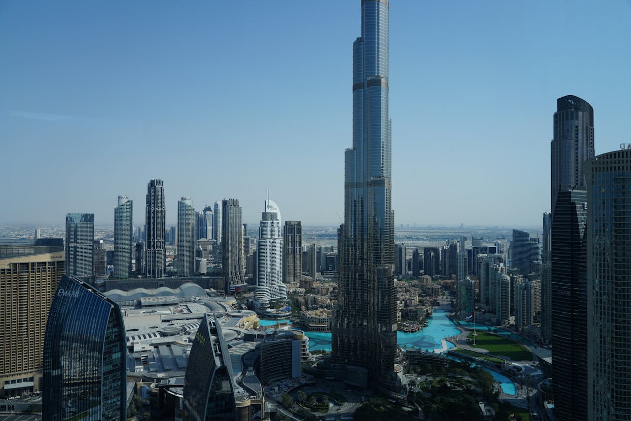 A breathtaking high-angle view of the iconic Burj Khalifa and modern Dubai skyline during the day.